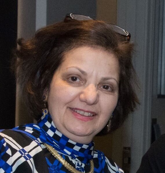 Woman in a patterned blue scarf, portrait