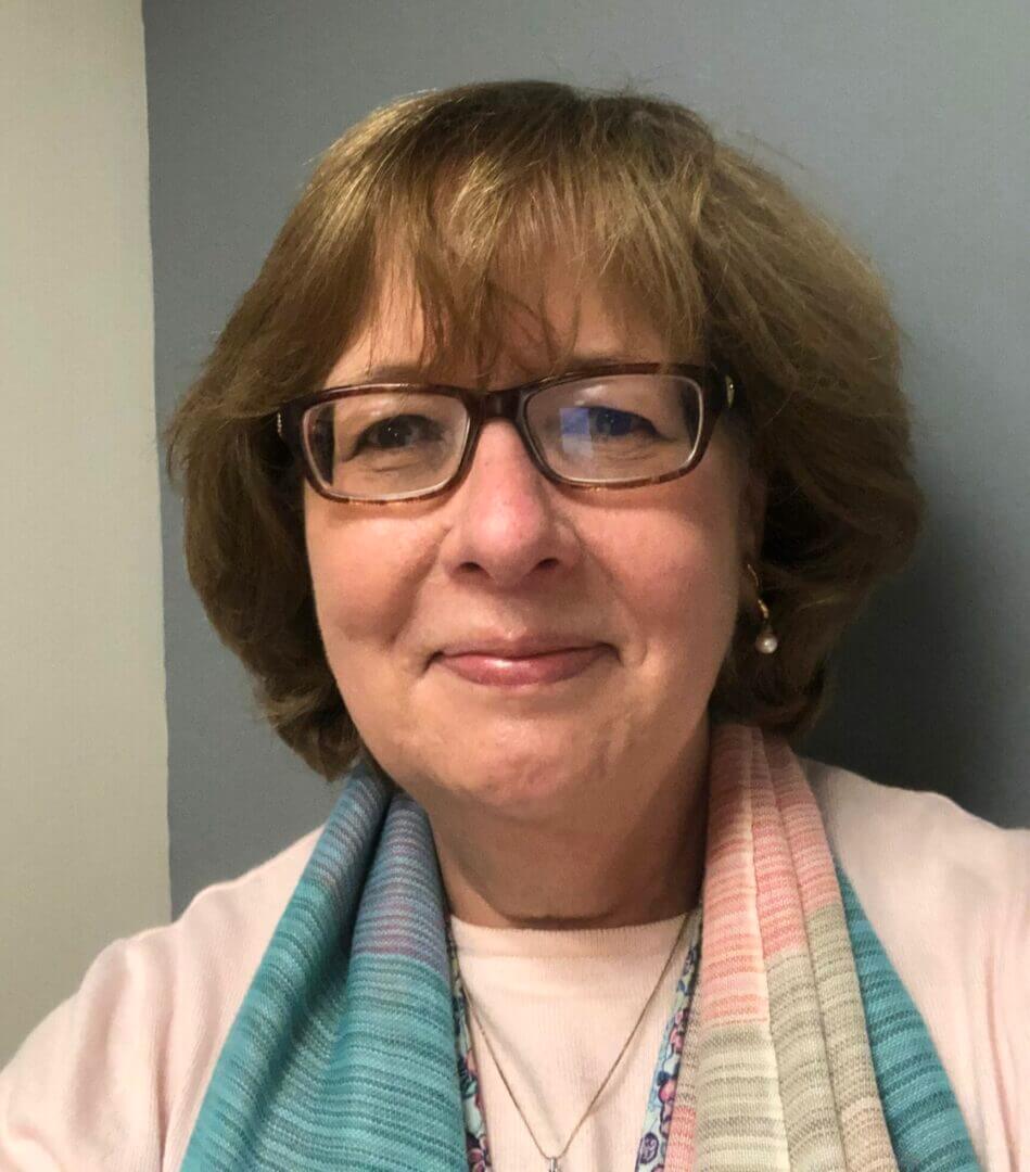 Woman with glasses and a scarf, portrait