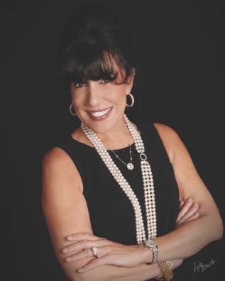 Woman with dark hair and a pearl necklace, portrait