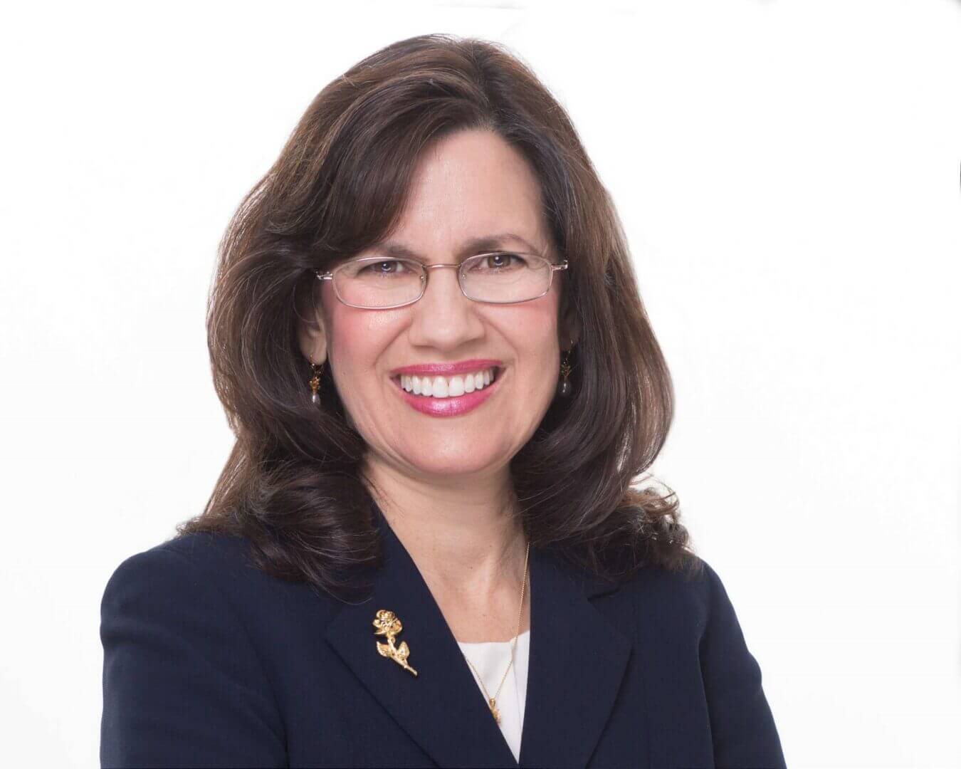 Woman with glasses in a navy jacket, portrait