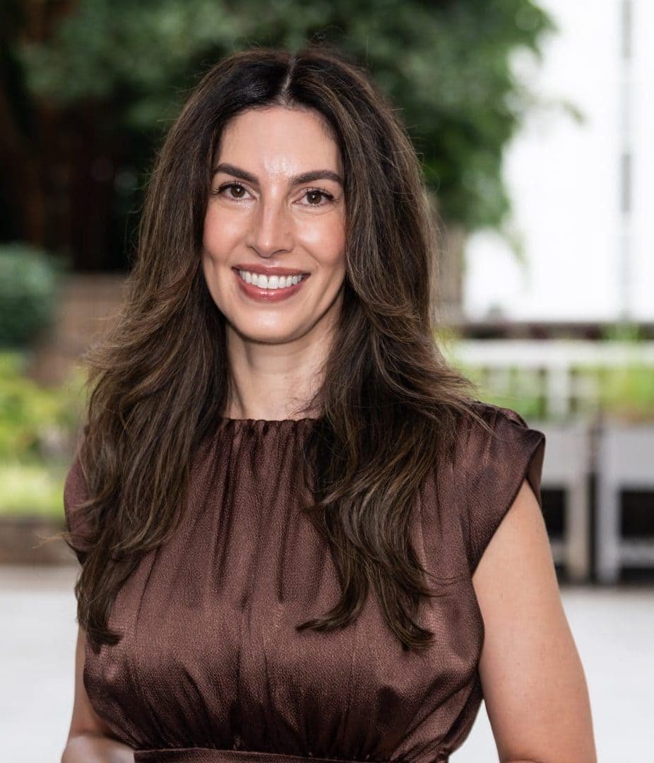 Woman in a brown dress outdoors, portrait